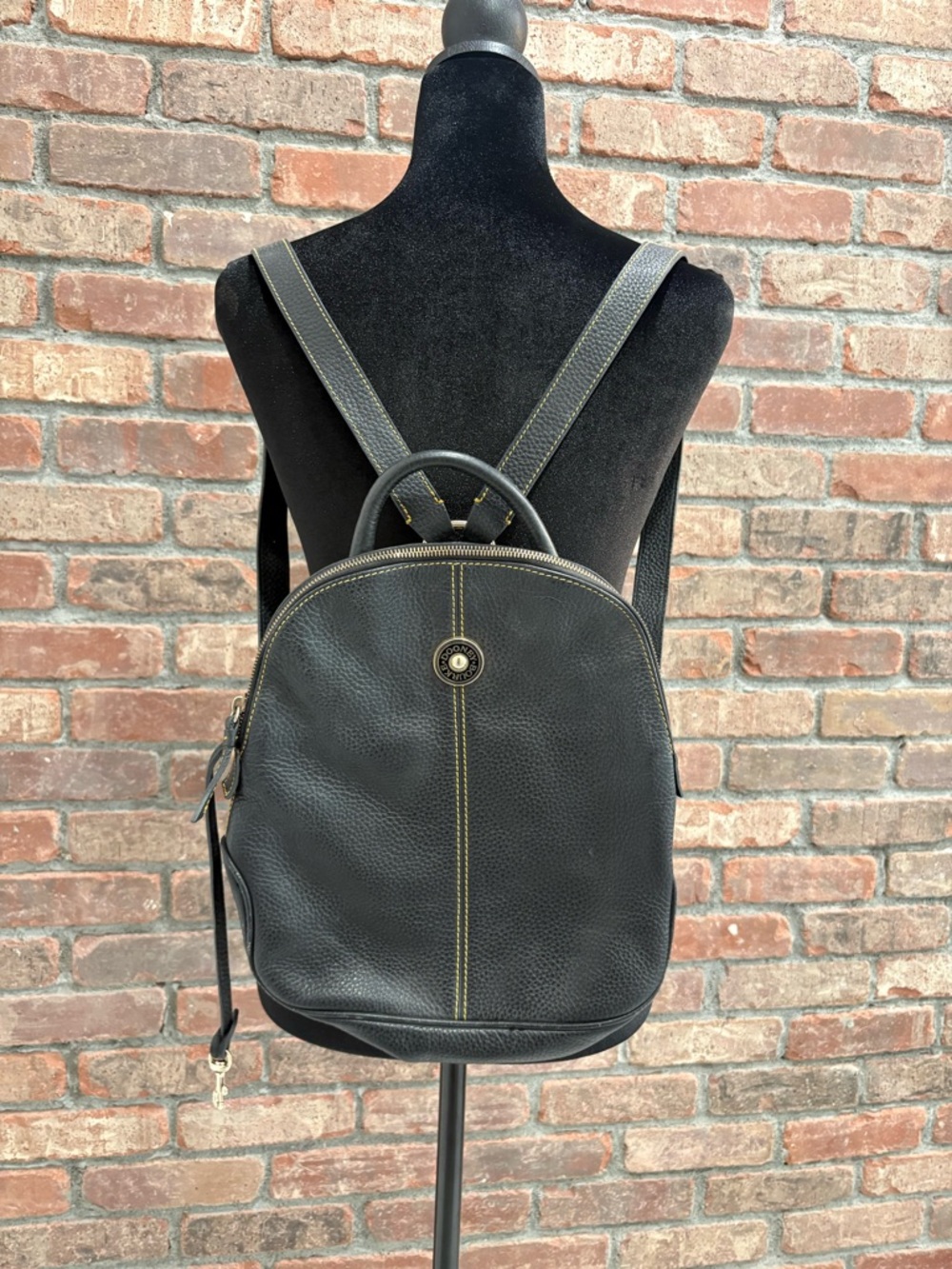 Dooney & Bourke Black Leather Backpack with Yellow Contrast Stitching